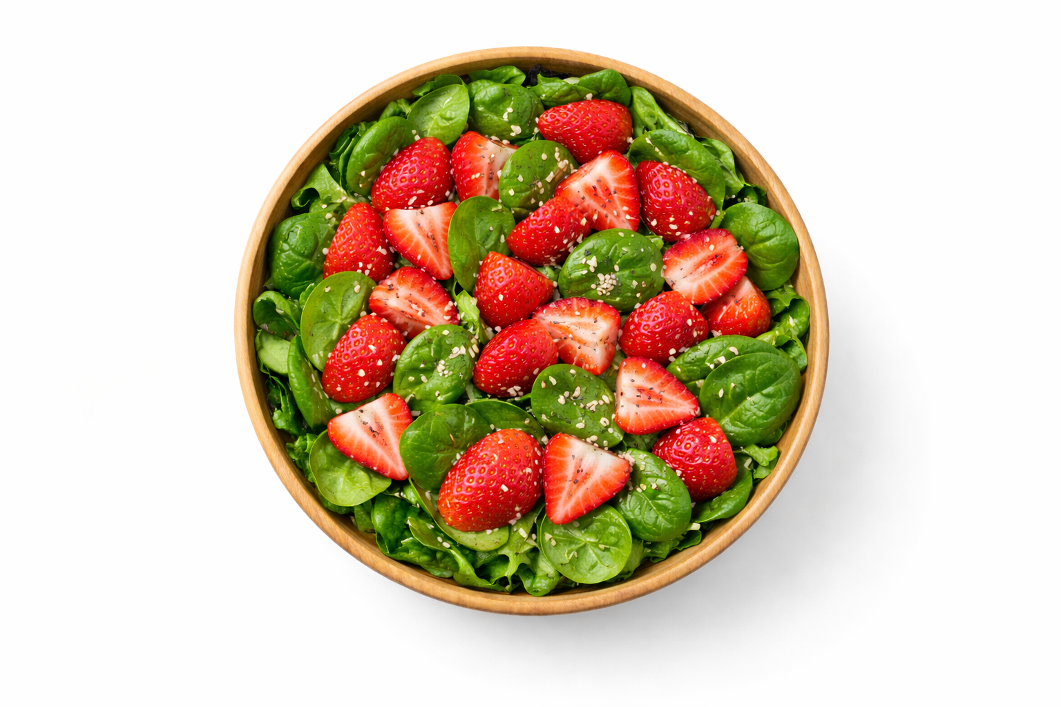 Spinach and strawberry salad in a large serving bowl